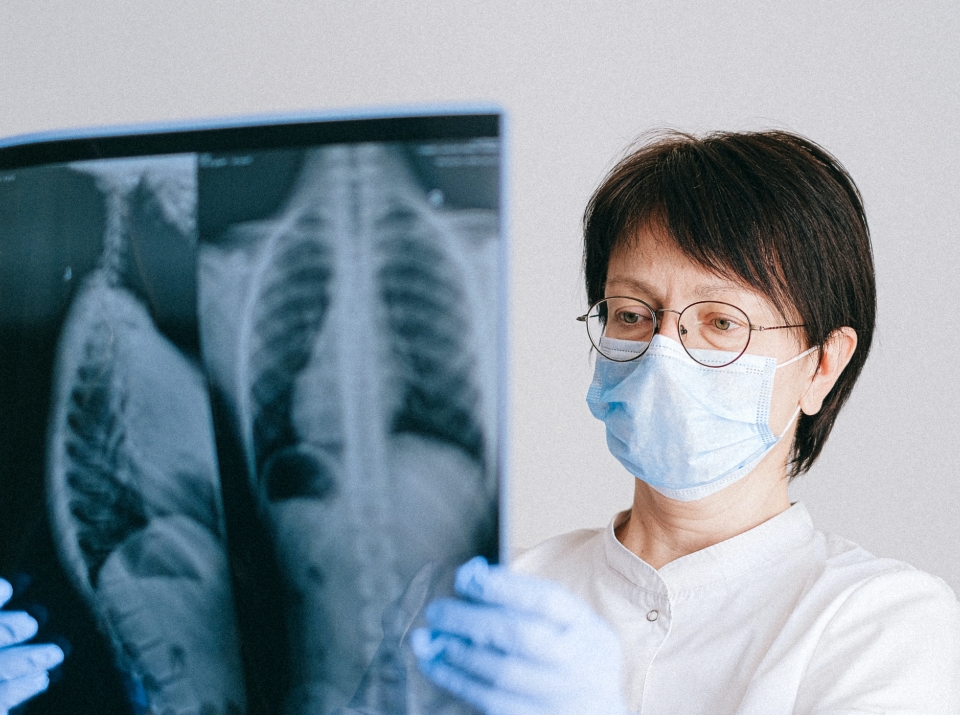 Doctor Looking at X-ray